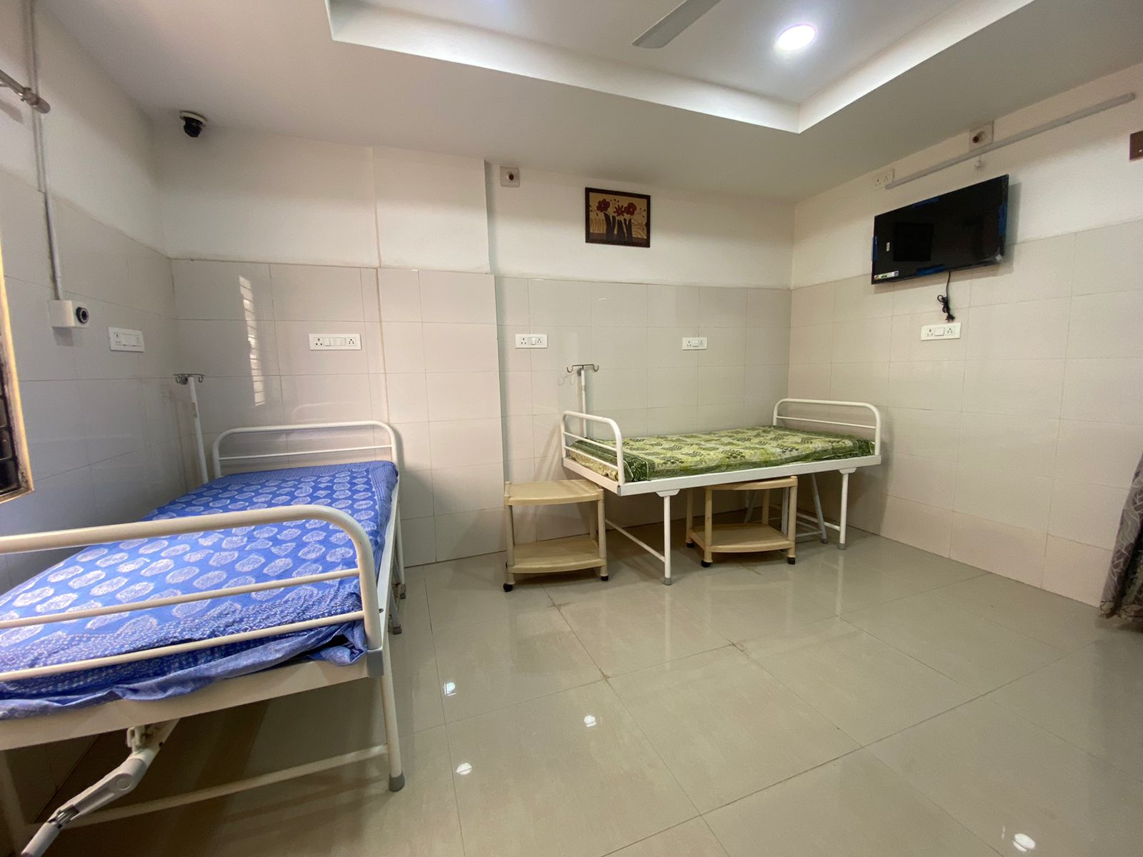 Well-appointed patient room with medical equipment