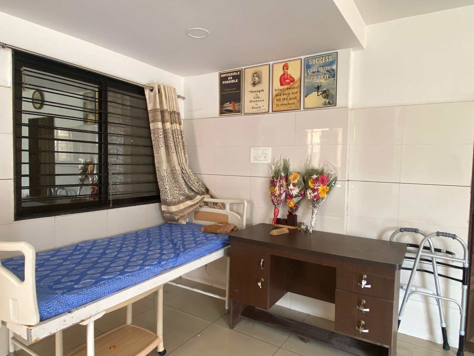 Patient room with motivational artwork and storage